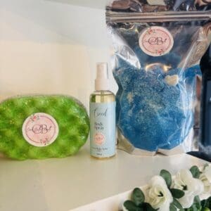 Coco Bella Melts green sponge, Creed body spray and blue bath product