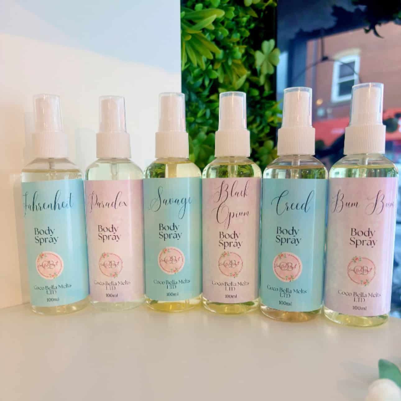 Six Coco Bella Melts body spray bottles in assorted fragrances